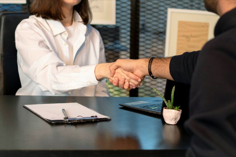Two business owners shaking hands